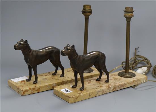 A pair of Art Deco marble and bronzed spelter table lamps, mounted with dogs